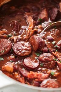 A pot of red beans and rice cooking on the stove #red #beans #rice