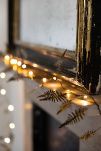 Take inspiration from nature in your festive display with the beautiful Gold Fern Fairy Lights. When it comes to Christmas light decorations, nothing is more magical than the twinkling of fairy lights. As a staple for seasonal styling, battery-operated fairy lights like this fabulous fern design can be styled anywhere, from the dinner table to shelves or your mantelpiece. However, these beautiful battery fairy lights are also a gorgeous addition to your home throughout the year. Handmade and han