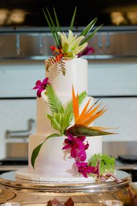 Tropical Cake Flowers at Hotel Emma | Birds of paradise, calla lily purple, lily oriental siberia white, orchids dendrobium purple and white, robellini palm | Photo by: Two Sapphires Photography | Jill McCarty with Couture Concierge