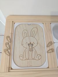 Embark on a journey of tactile wonder with our flisat/trofast Easter bunny & carrot activity. Crafted with love and precision, this toy transforms the spirit of Easter into an immersive sensory experience for your little ones.  Made to fit large flisat/trofast sensory bins from Ikea.  Purchase includes 1 x bunny insert, and 6 x carrots for feeding to the bunny.  Each piece is laser engraved in wood by me in my workshop in Brisbane (Australia). Given that wood is a natural material, it is possibl