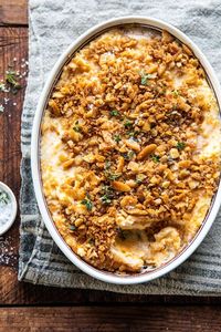 Cheesy Potato Casserole with Buttery Ritz Cracker--the only side dish recipe you really need. These potatoes are creamy, cheesy, and perfectly seasoned. The Ritz cracker topping is a touch buttery, perfectly garlicky, herby, and a little salty too.  Make these ahead of time for an easy holiday side that everyone will love.#cheesypotatoes #Christmasrecipes #potatocasserole