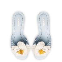 Celebrate with the warming weather with an ode to one of our favorite blooms. This delicate magnolia floret embellishes the front of this wear-anywhere mule for the kind of striking accent we love.