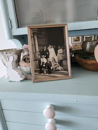 Vintage Metal Frame With Wedding Party Photo The gold-tone style metal frame with a photo of a beautiful bride & groom. The frame measures 5 x 7 inches. The metal has discoloration due to age. This is a vintage frame so it will not be perfect. I am not sure the age of the  frame. See photos for the condition of the frames. Sold as is with original charm. All items are vintage { over 20 years old } will not be in mint condition.