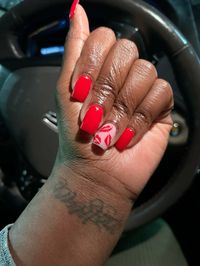 Red valentine nails with lips on the accent nail