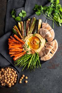 Springtime Hummus Bowl with Roasted Veggies #asparagus #carrots #chickpeas #lemonevoo #pitabread #tahini #zucchini