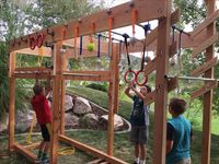 Ninja Warrior training course I made for the kids ( and myself) in our back yard. It has a peg board circuit, ring toss peg circuit, monkey bars, gymnastic rings, grip strength balls and dowels for sloper pull ups and swinging, and (of course) a salmon ladder!