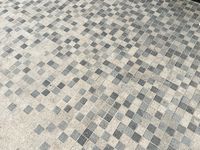 Paving detail at The Beach Dubai by Cracknell - mix if three colour greys 50mm x 50mm granite