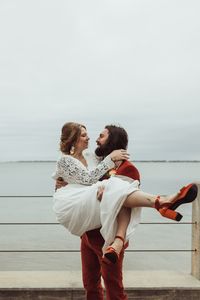 We snuck away down the street to the bay for these newlywed portraits - this retro backyard wedding was dreamy, intimate & full of love! elopement inspiration // intimate wedding ideas // small wedding ideas // elopement pictures // elopement aesthetic // small elopement wedding // elopement photographer // Panama City, Florida // #pcbfl #elopementphotography #coastalelopement #flintimatewedding