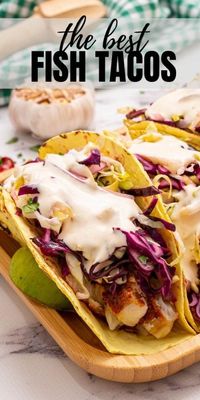 This is the easiest, most flavorful recipe for fish tacos! Tender white fish is baked to flaky perfection after being rubbed with a bright, spicy seasoning rub. The tacos are assembled with a fresh cabbage slaw and a creamy chipotle sauce for the perfect balance in flavors and textures. These fish tacos are must make, healthy family meal!