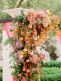 California wedding vendors created an urban garden wedding in downtown LA for this couple's wedding and we are obsessed! Bursting vibrant colors, this traditional Indian wedding has a modern twist and just wait until you see the ceremony arch. #GORG