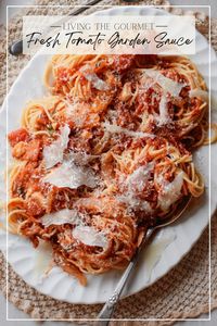 This Fresh Tomato Garden Sauce Recipe is blissfully delicious with its vine-ripe tomato base, herbs, cheese, and wine for added depth!