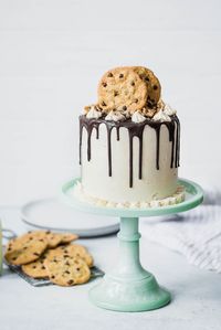 A triple layer Chocolate Chip Cookie Cake made with mini chocolate chips, buttercream frosting, and a sinful chocolate ganache drizzle. Best. Cake. Ever.