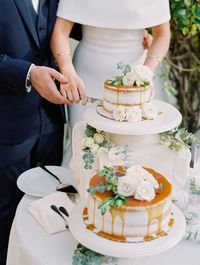 A chic #SantaBarbaraWedding with a #weddinggown that reminds us of Jackie O.  PHOTOGRAPHY Gaby J Photography FLORAL DESIGN Alexis Ireland Florals RECEPTION VENUE Villa & Vine PLANNING With Love by Tara M