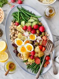 You'll love this vegetarian spin on a Niçoise salad! It's filled with bright, briny flavor from olives, capers, and lemon vinaigrette. Packed with fresh veggies, it's a hearty, healthy summer meal. | Love and Lemons #salad #nicoise #healthyrecipes #vegetarian