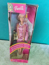 Here we have a Class of 2004 Graduation Barbie doll. Still in box. The box is in bad condition from storage. The doll has never been removed from the box.