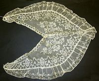 Pelerine - early 19th century. A wide, capelike collar that extended across the shoulders and down the bosom