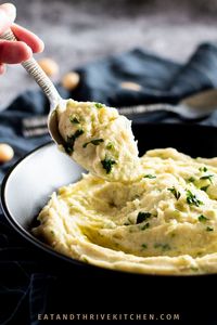 This Potato and White Bean Mash recipe is the perfect healthy side dish that is super easy to make and can be vegan-friendly. Made with creamy butter beans, fluffy mashed potatoes and garlic, this comforting mash is rich, buttery (but without the butter) and delicious! This recipe can be made with any white bean (butter/lima or cannellini beans) or vegetables such as potatoes or cauliflower. Learn how to make this creamy Potato and White Bean Mash with Garlic recipe at eatandthrivekitchen.com