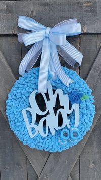 New baby boy wreath for nursery or front door. Made of loop yarn. #babyboywreath #babywreaths #bluenurserydecor #newbabydecor #babyboyshowergifts #pinklimewreaths