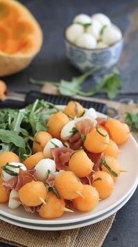 Melon, Prosciutto, and Mozzarella Skewers. I might switch out the prosciutto-- not sure. Great idea for a party.