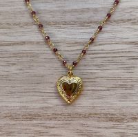 This dainty necklace is handcrafted using a 2mm authentic garnet wire-wrapped chain and a 11mm heart pendant. The chain and pendant are 24k gold plated.  This necklace is hypoallergenic. (Cadium free, lead free, and nickel safe) Garnet is an energizing stone that promotes passion and love.  The necklace comes in a ribbon-wrapped box, ready to be gifted. If you would like to leave a note for the recipient, you can do so during checkout.