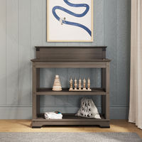 Classic lines and beautiful craftsman-era hardware combine to highlight the Redmond Collection's timeless style. The Redmond baby changing table provides a safe and convenient space for your baby's changing and dressing needs, while providing 2 shelves for extra storage. Available in 2 classic finishes.