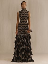 A black high-neck organza tiered ruffle dress with hand-applied silver beaded lace embroidery.