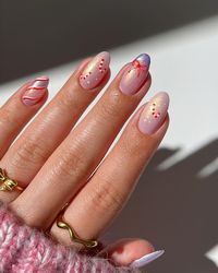 Cute candy cane nails on a shimmery base 🎀🧸🍭💕swipe left for tutorial👀 • • • • • #nailart #nails #nailinspiration #candycanenails #nailinspiration #cutenails #prettynails #naildesign #nailideas #christmasnails