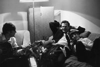 john lennon, brian epstein, and ringo starr