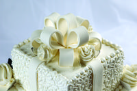 Hand made white fondant bow on our traditional wedding cake