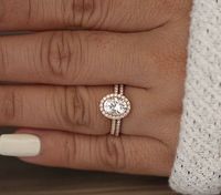 Engagement Ring Details 14k Solid Rose Gold (Also can be made in White and Yellow Gold, Please select your choice At Checkout) 1.5-1.6mm (Approximate Band Width) Natural Moissanite (Center Stone, Charles & Colvard Certified Forever Classic) Oval 9x7mm (Dimensions of Center Stone) 2.00 carats (Average Weight of Center Gemstone) VS1 Absolutely Clean (Clarity) Natural Conflict Free White Diamonds 0.20carats (Total Diamond Weight) G-H (Diamond Color, White) SI (Clarity, Very Eye Clean and Brilli