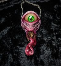 The original cyclops pendant! These have been copied by many people over the years, which has been very disheartening, but I still make them occasionally.  Measures 3.75 inches long.