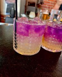 Beautiful contrast of the purple and yellow liquids #alcohol #butterfly #drink #yum