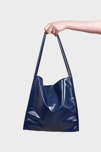 Shop for Navy blue high shine PVC tote bag at Glassworks London. Free UK shipping for orders over £75. Buy Now Pay Later with Klarna.