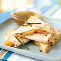 Peach and Brie Quesadillas are a delicious departure from the norm. Use ripe peaches and serve with Lime Honey Dipping Sauce for the best result.