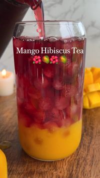 Ingredients🌺 2 tbsps dried hibiscus flower  5 cups boiling water  1 large mango  1 tbsp lemon juice  2 tbsps agave syrup  1 tbsp water  Ice  🥭How to make mango hibiscus iced tea🌺 1. Hibiscus Tea: Add 2 tablespoons of dried hibiscus flowers to a tea kettle and pour in 5 cups of boiling water. Let it steep and cool down completely. To speed up the cooling process, transfer it to the fridge after 30 minutes. 2. Mango Purée: Slice a large ripe mango and add it to a blender with lemon juice, agave syrup, and a splash of water. Blend until smooth. Store in an airtight container in the fridge. 3. Serving: In a glass, add mango purée, ice, and chilled hibiscus tea. Stir well and enjoy!