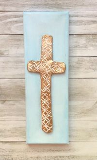 Hand sculpted clay cross with textured design finished in gold & brushed white. Cross sits on a long canvas measuring 12" x 4" and finished in pale blue acrylic. All items in my store are customizable - feel free to request a different size or color background. This artwork makes an adorable gift for a new baby, first communion, Easter, and so much more!