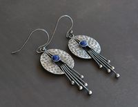 "These lovely earrings with lapis lazuli are entirely handmade in sterling silver. They have been textured, polished and oxidised. The total length of the earring from the top of the wire hook is approximately 5.3 cm ( 2\"). The earring is approximately 1.9 cm (0.7\") wide at the widest point. Lapis lazuli: 4 mm The earrings are sent in a gift box. Each piece is handmade, so slight variations may exist from the item photographed. THIS ITEM IS MADE TO ORDER. PLEASE ALLOW 7 BUSINESS DAYS BEFORE SH