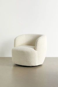 Cozy and chic, this swivel chair offers an inviting and modern look with smooth, curving lines all over. Cushy to the touch, this chair is perfect for curating your minimalist space. This custom furniture will be made to order just for you. Features Cozy swivel chair Upholstered allover in faux sheepskin Swivel base Made to order just for you Content + Care Solid pinewood, polyurethane, polyester fill Spot clean Made in the USA Size Dimensions: 30" w x 34" d x 30" h Interior seat dimensions: 22"