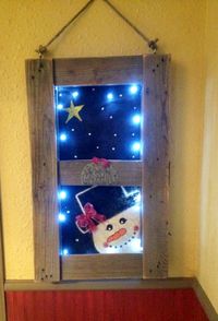 Glowing winter wood pallet window