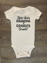 How does Grandma and Grandpa Sound? This listing is for one (1) white bodysuit  with black lettering on the front. Available in short sleeve.  Available Sizes:  Newborn 3 Month 6 Month  9 Month  12 Month I hand make each bodysuit, no two will be exactly the same, please allow 3-7 business days for production. Please email me with any questions.  Material: White 100% Cotton  Care Instruction: Inside out wash Tumble Dry Do not bleach Do not iron directly onto the design Do not dry clean Want to se