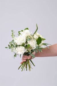 This collection features gunni eucalyptus, lemon leaf/salal, white roses, white spray roses, white stock, white veronica, and white waxflower.