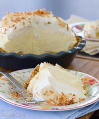 This light and fluffy banana cream pie recipe is loaded with fresh bananas and silky filling, then topped with piles of whipped cream and toasted coconut.