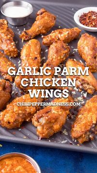 This crispy baked garlic parmesan wings recipe is tossed with a homemade garlic-parmesan sauce that you can make in minutes. It's always time for chicken wings. It's chicken wing night in the Chili Pepper Madness kitchen, my friends! Are you with me? If you're a chicken wing lover like I am, these amazing wings will surely satisfy.