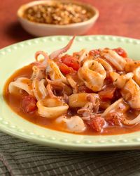 Spicy Calamari in Red Sauce (Serves 4-6) Ingredients 2 T olive oil 1 T minced garlic 1 t crushed red pepper 1 cup white wine 3 cups Red Sauce (recipe follows) 2 lbs. calamari cleaned and cut into 1…