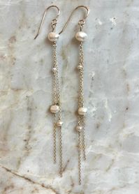 Lightweight, effortless elegance. These long, freshwater pearl, 14kt GF Chain earrings are perfect bridal earrings or an effortlessly chic look for any event.