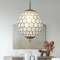 Glam up a dining room or living room with this vintage capiz shell chandelier, as a natural elements decor your home. Hundreds of brass-encased, high-quality natural shells are combined to form a globe lampshade, producing a dramatic play of light and a softly diffused glow. This natural seashell chandelier will add mid-century or french country decor style to your home. It only measures 12" tall, so it can work in space-conscience homes. This fixture hangs from an adjustable chain and has a slo