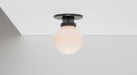 A tightly edited version of its siblings, the Elma Flush Mount emanates a soft glow from a singular blown glass orb. An homage to the elegance of simple shapes paired together.