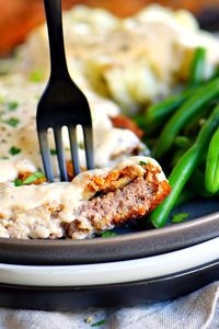 The Ultimate Chicken Fried Steak is fried to golden perfection and topped with the creamiest gravy you can imagine. It's hard to imagine a more quintessential Southern meal than Chicken Fried Steak and Gravy. The hard part is deciding whether you want to make it for breakfast or dinner. My family can't get enough of these tender steaks with that delightful crispy, crunchy coating. And the gravy? Heaven! // Mom On Timeout