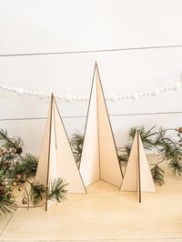 "Modern Wooden Trees, Wooden Tree Set, Christmas Decor, Holiday Decor, Wood trees, laser cut trees,  Custom trees, Modern Christmas Decor Spruce up your home with our beautiful, handcrafted trees. Our trees are the perfect holiday gift for a loved one, or yourself!  // SIZE // Please choose your size preference from the drop down size menu. Measurements are described in height from top to bottom of the tree. This listing is for ONE tree unless multiples are purchased. // FINISH // Please select