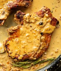 Juicy pan-fried pork chops drenched in a simple and delicious garlic sauce. | www.dontgobaconmyheart.co.uk